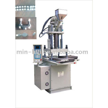 Machine de moulage par injection verticale